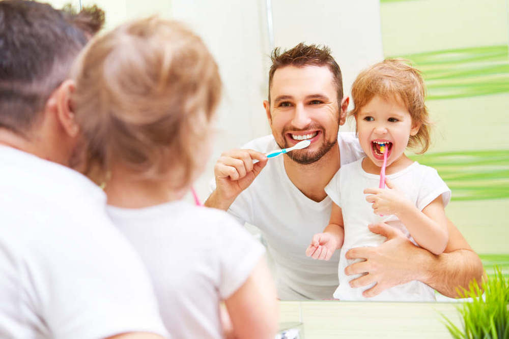 Happy,Family,Father,And,Daughter,Child,Girl,Brushing,Her,Teeth