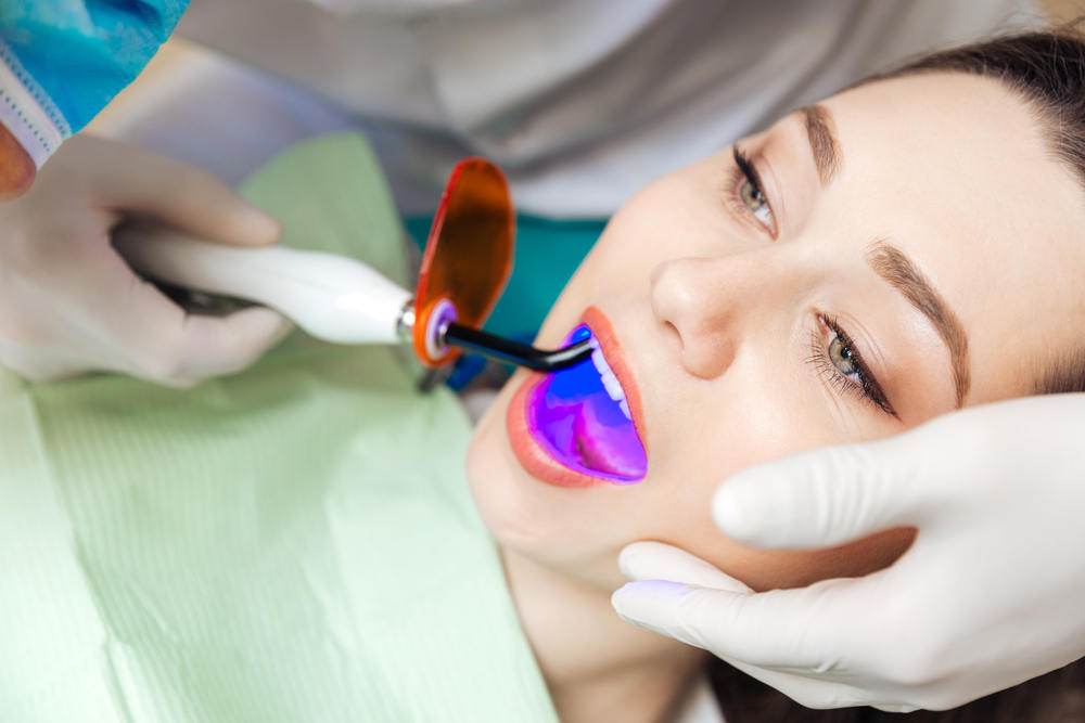 Close-up,Portrait,Of,A,Female,Patient,Getting,A,Bleach,Treatment