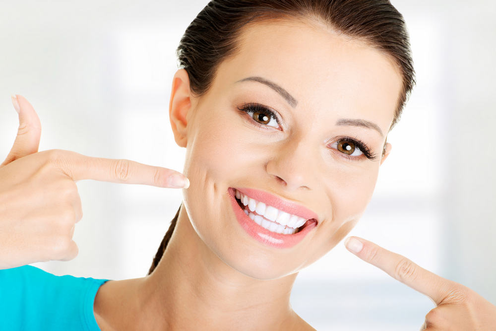 Woman,Showing,Her,Perfect,Straight,White,Teeth.